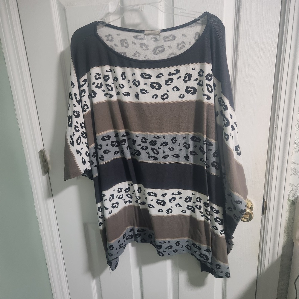 This is a women's leopard print casual top with a striped pattern.